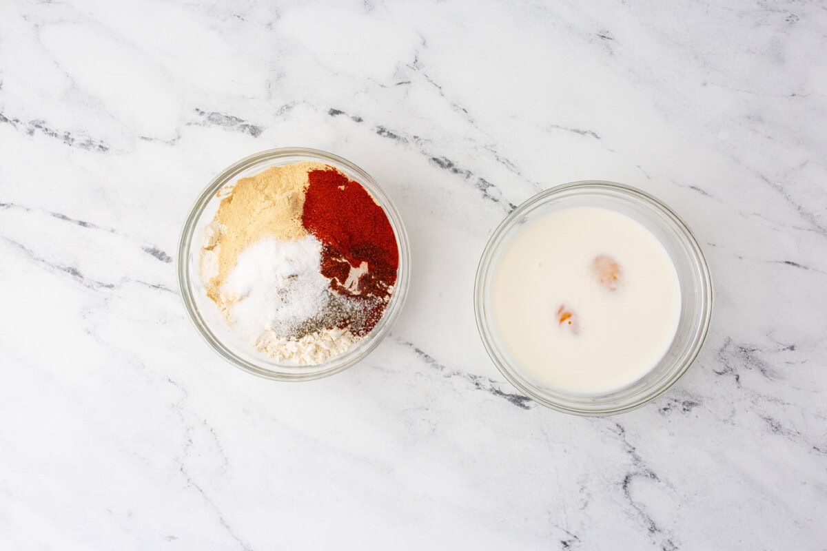 milk and eggs and seasonings in bowls