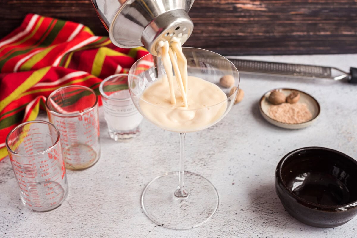 straining brandy alexander into martini glass