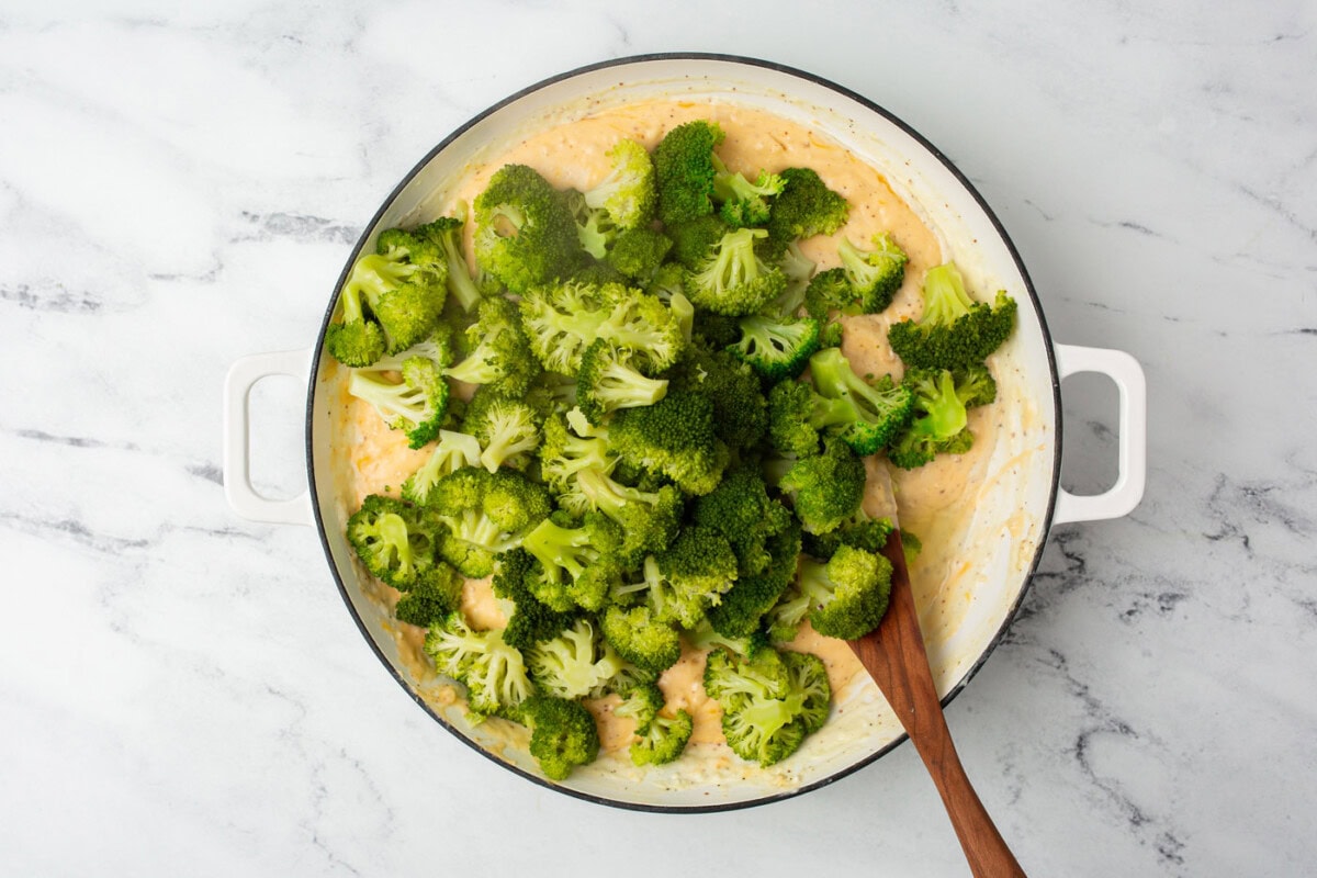 broccoli florets in a cheddar cheese roux