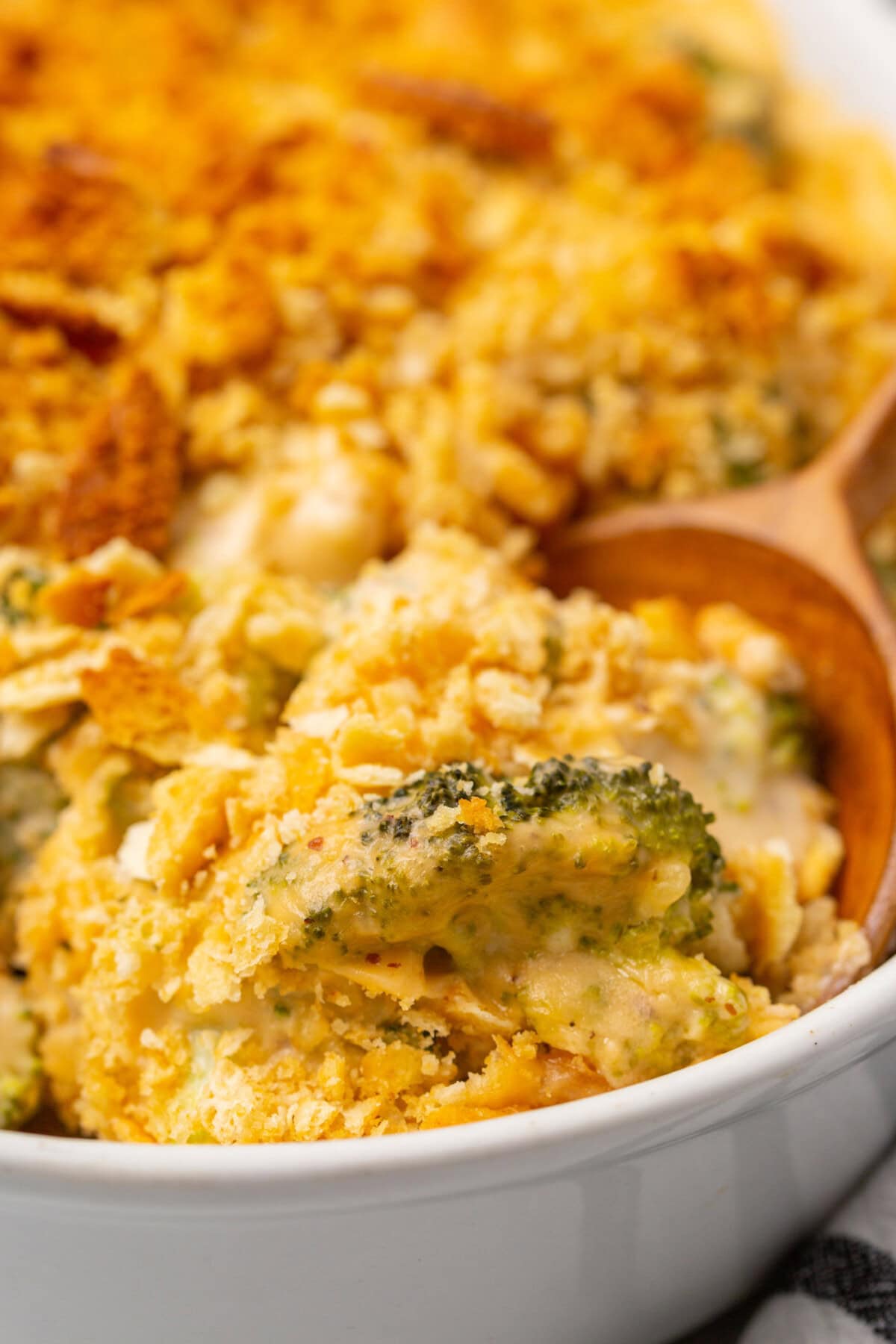 wooden spoon in dish of Broccoli Casserole