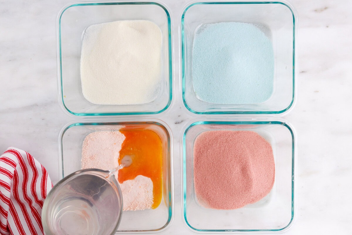 pouring boiling water into containers of jello