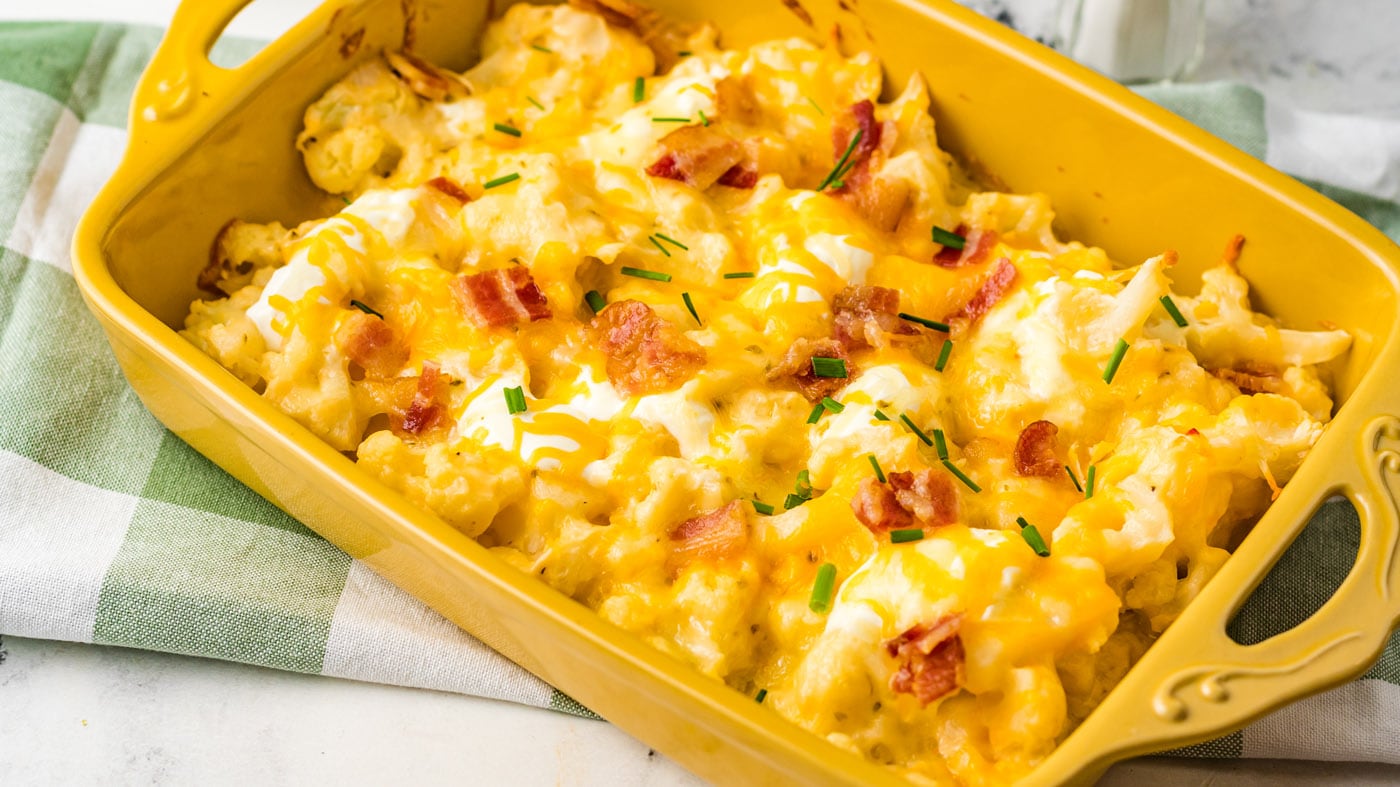This cauliflower bake is similar to a loaded baked potato. It has chives, sour cream, bacon, and loa