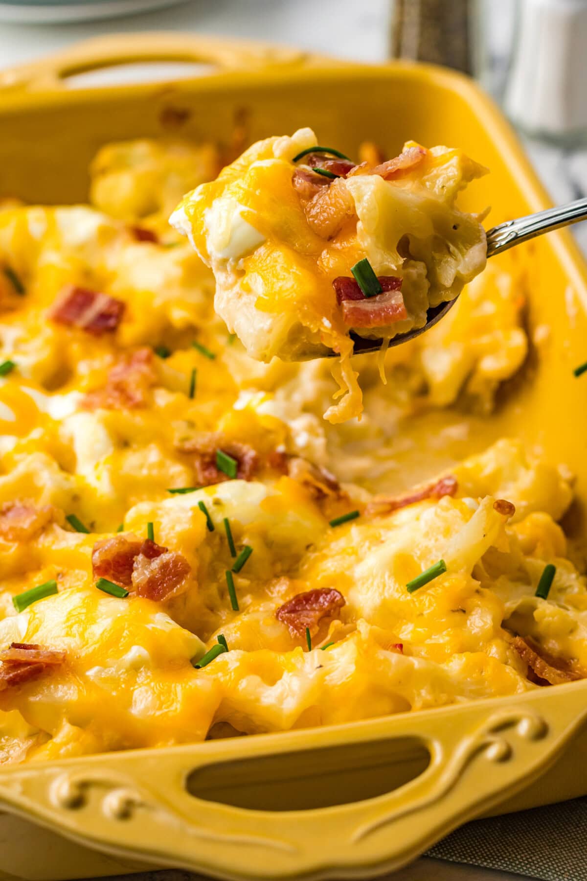 serving out Cauliflower Casserole