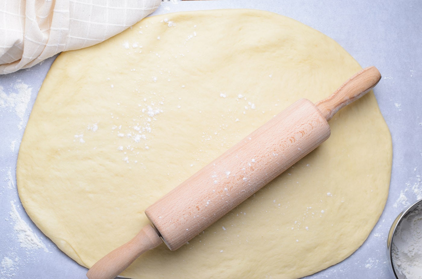 rolling babka dough out with a rolling pin