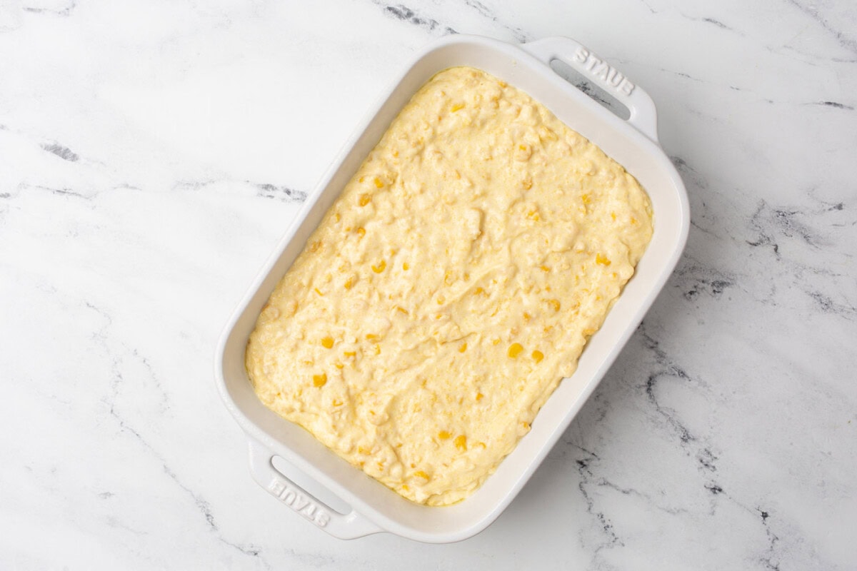 corn casserole ingredients in a baking dish