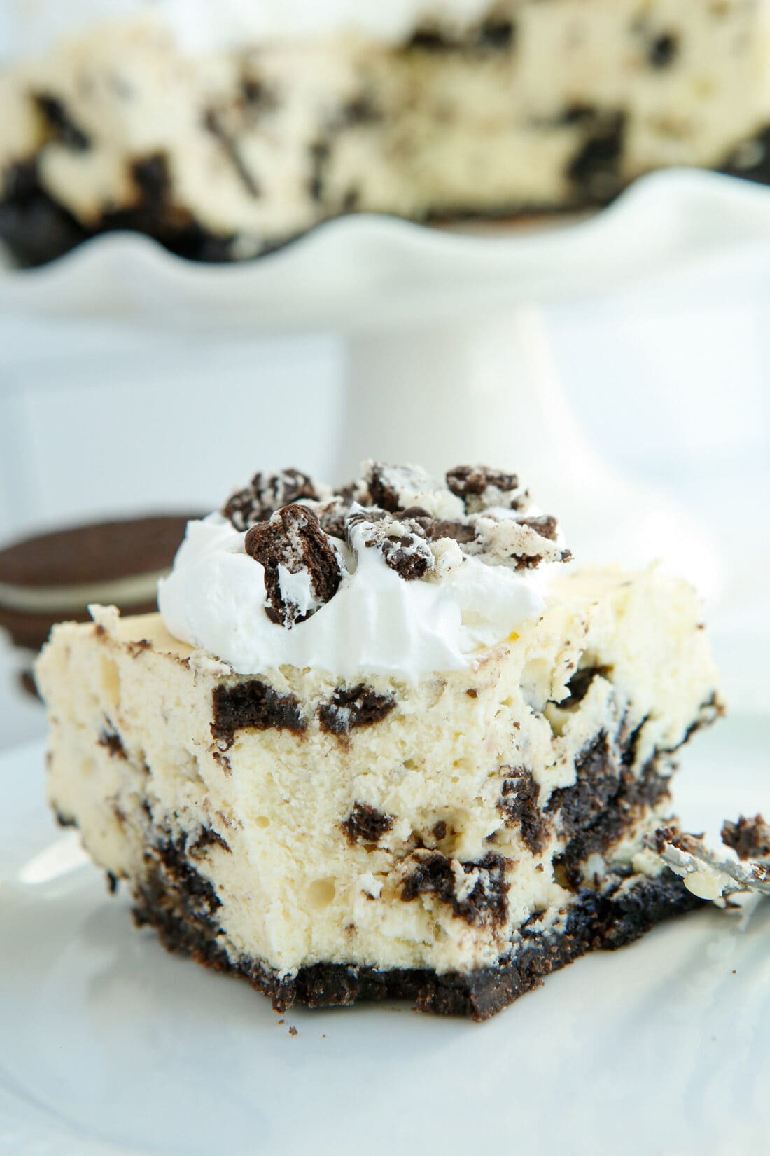 slice of Instant Pot Oreo Cheesecake with bite out of it