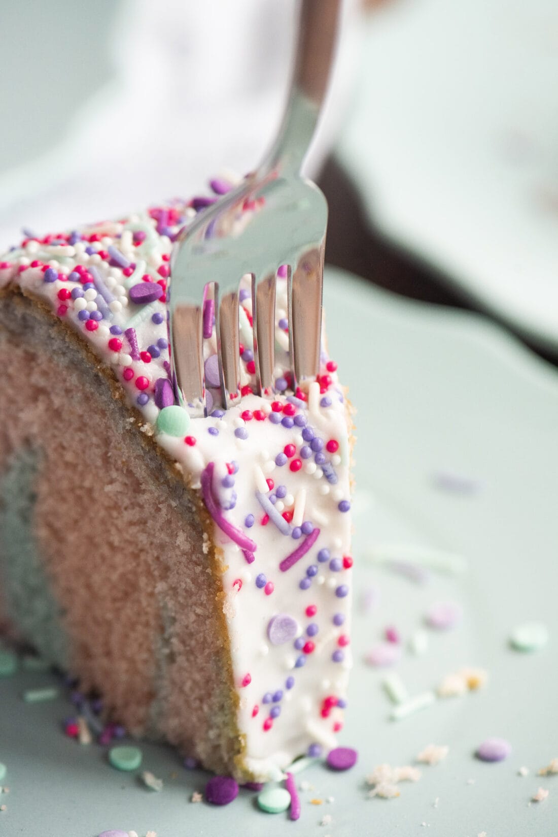 fork in a slice ofUnicorn Bundt Cake