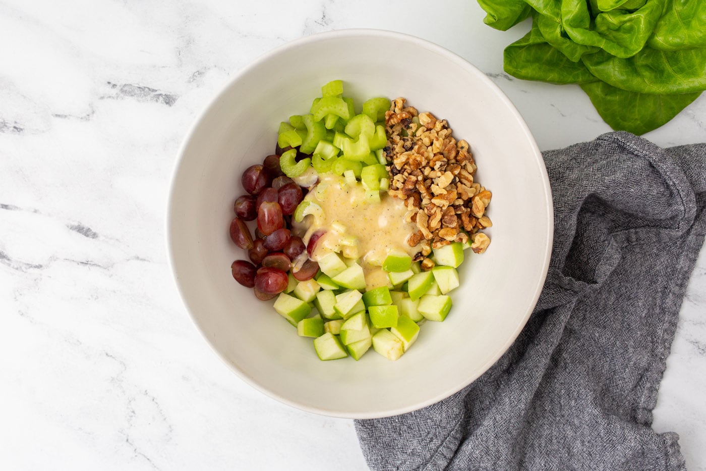waldorf salad with dressing in a bowl
