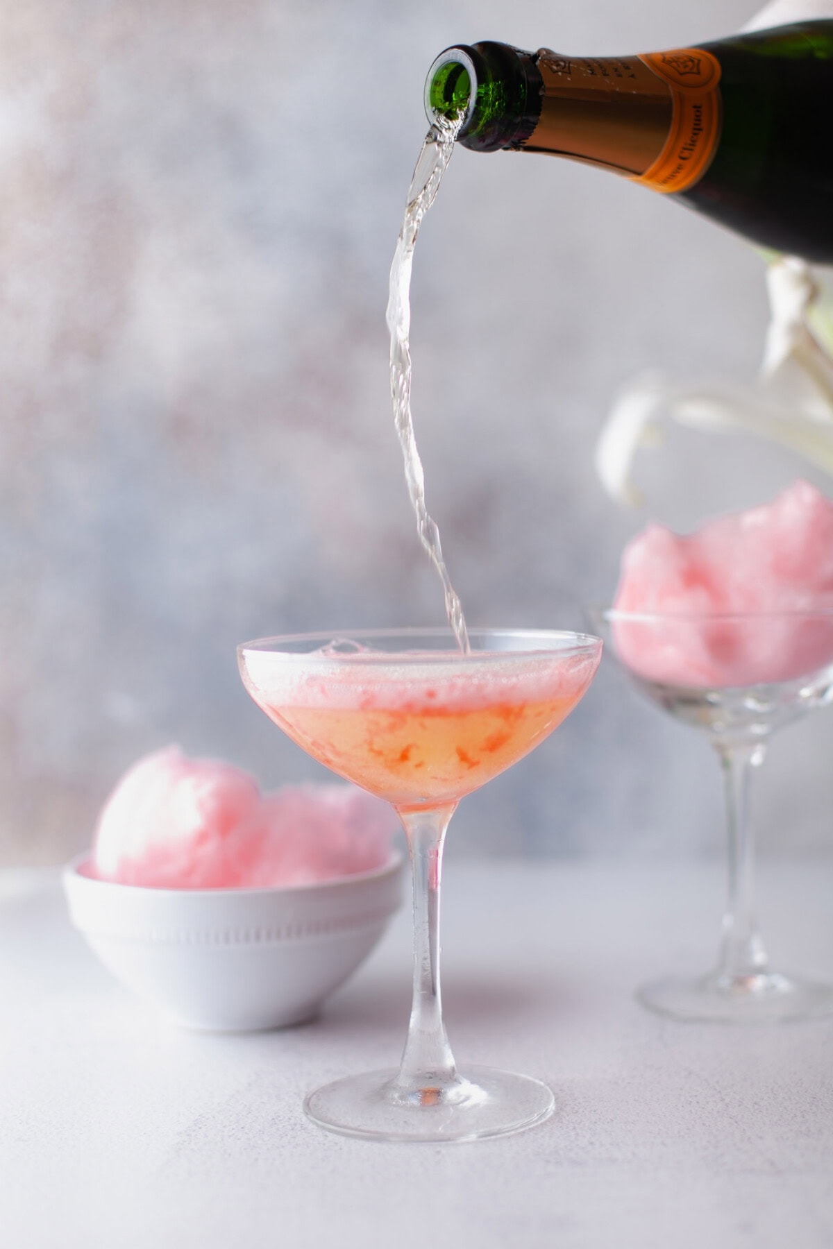 pouring champagne into cotton candy champagne
