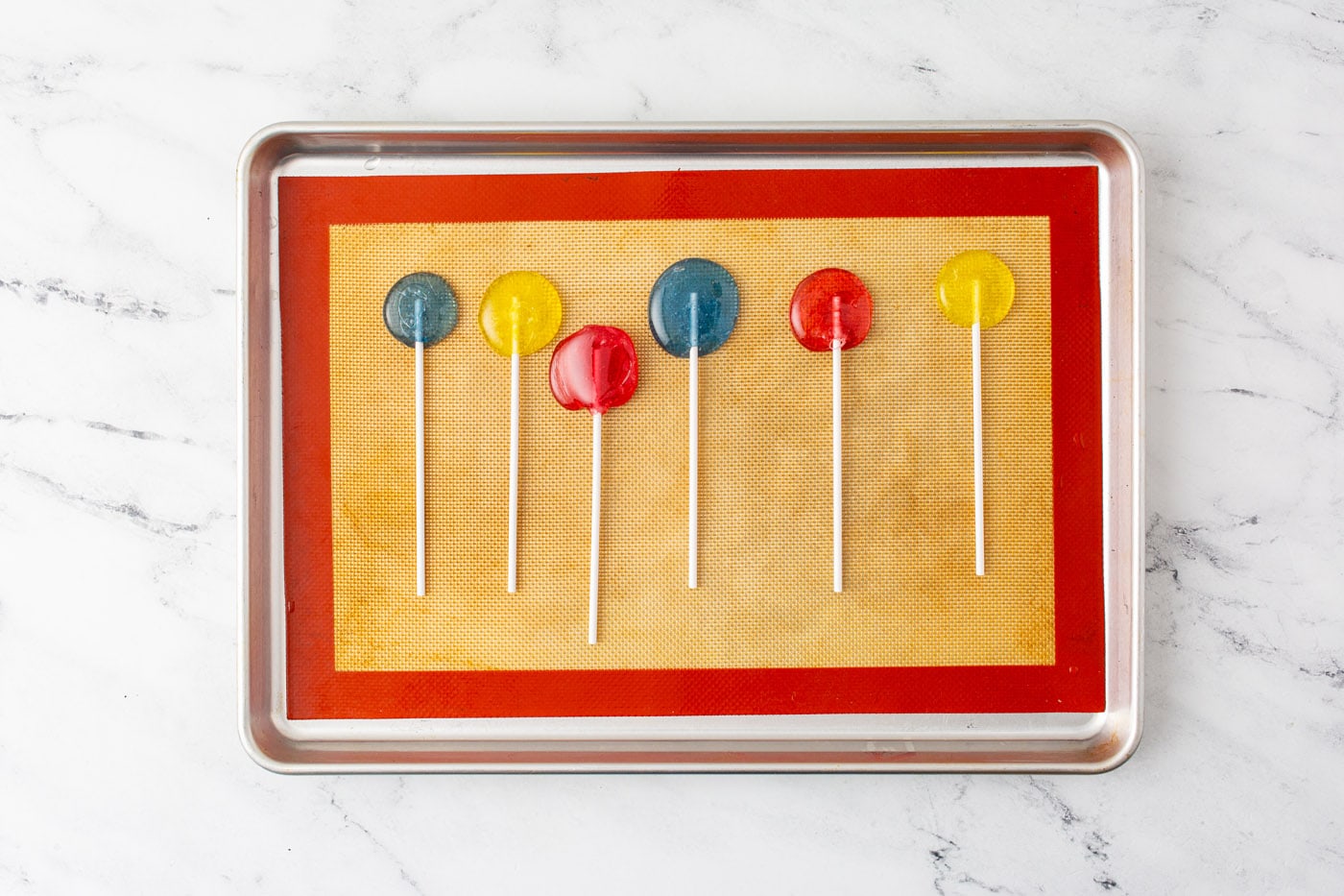homemade lollipops on a baking sheet