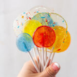 hand holding a bunch of Homemade Lollipops