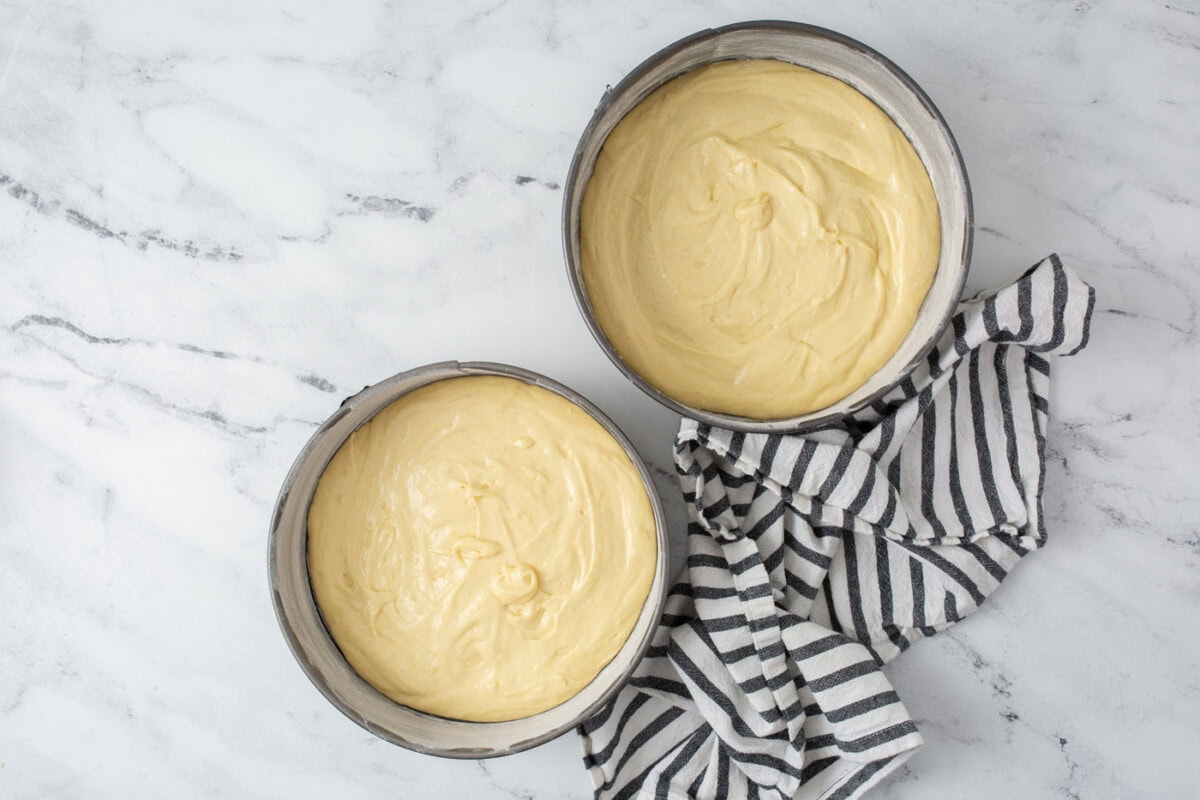 lemon cake batter in pans