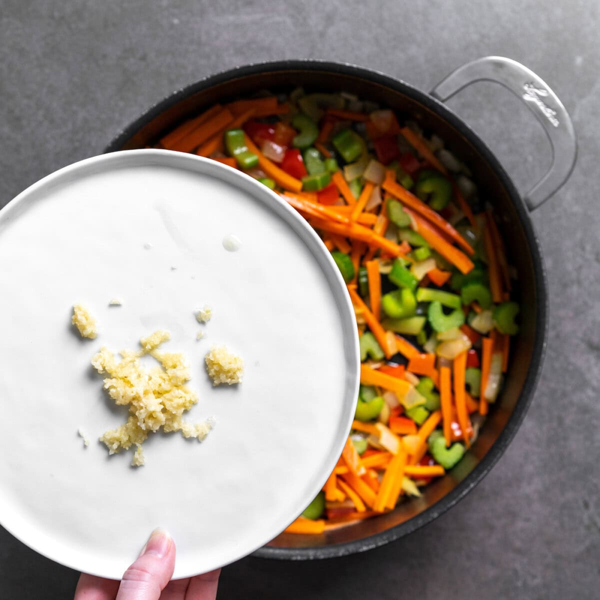 plate of minced garlic over sauteed veggies