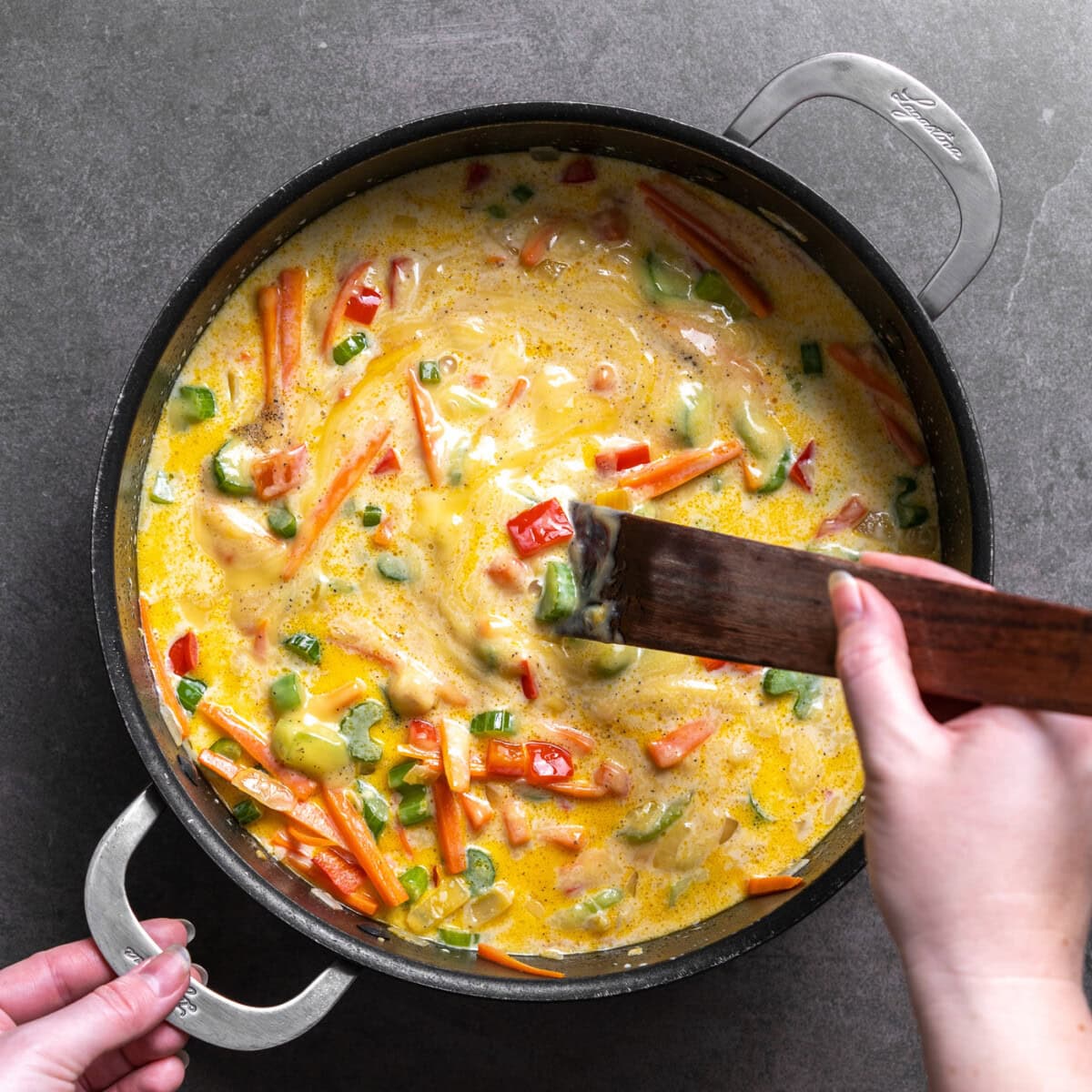 stirring chicken chow mein casserole sauce in a pan