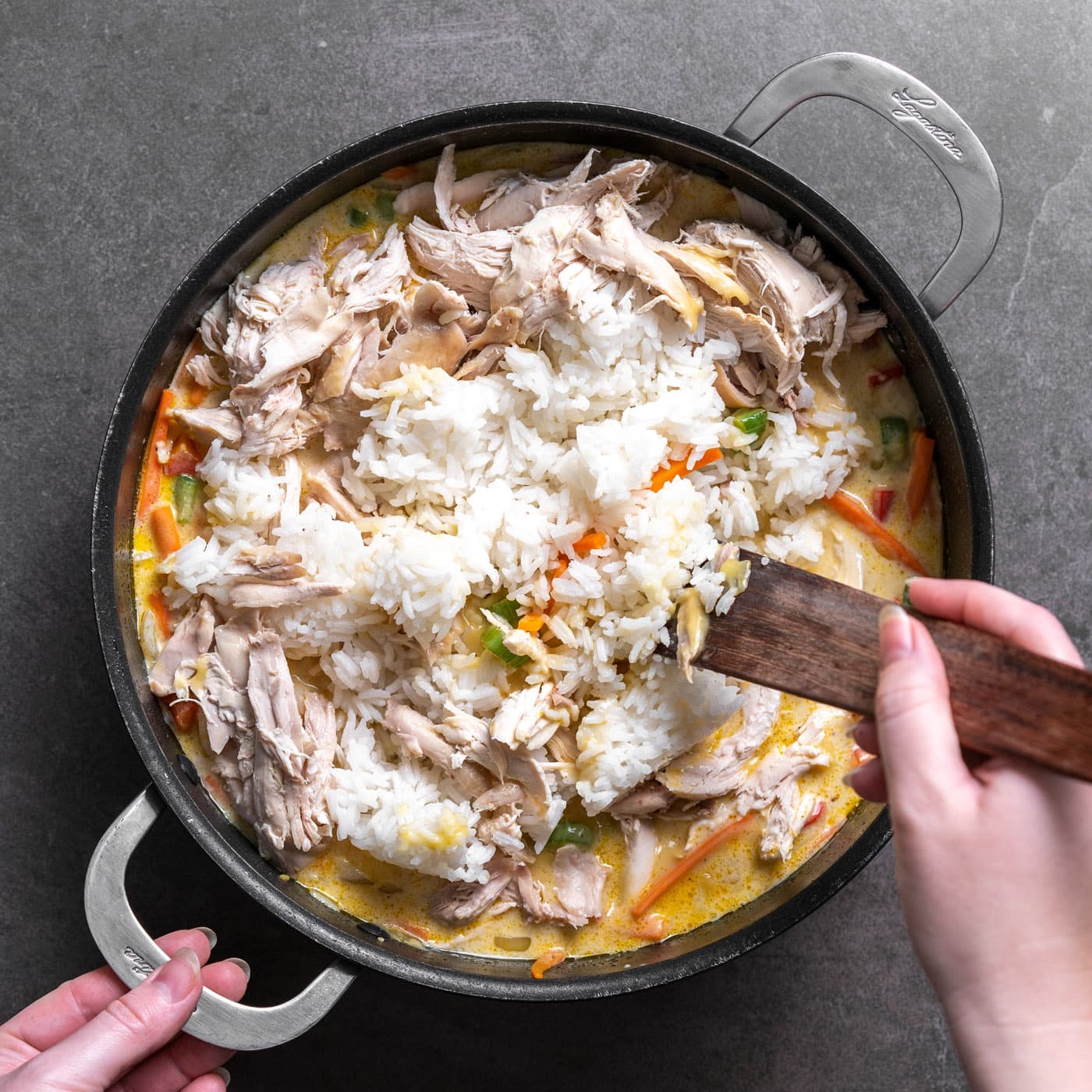 stirring chicken and rice into chicken chow mein casserole