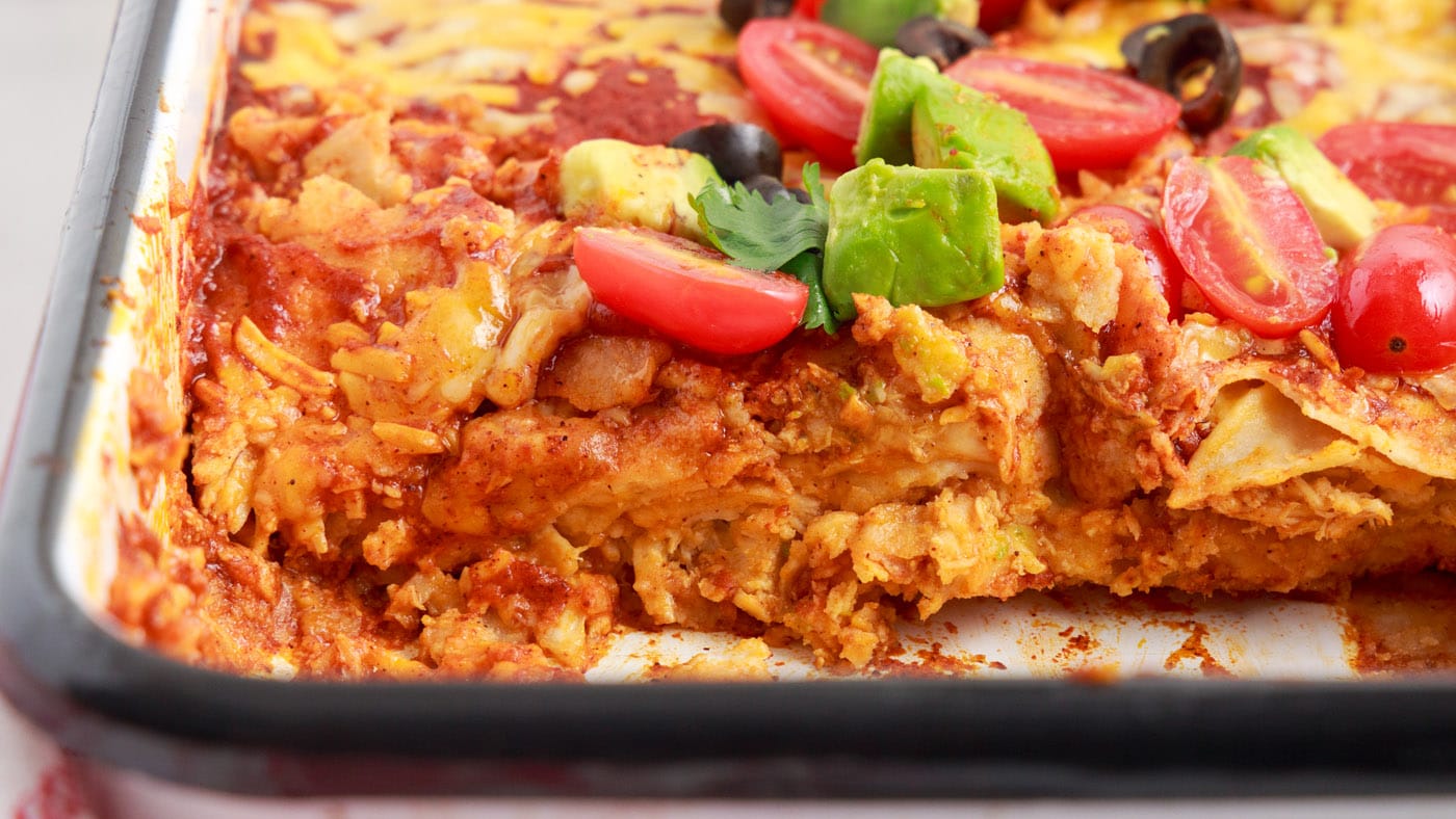 Triple layered with cheese, tortillas, and chicken, this chicken enchilada casserole is quick and ea