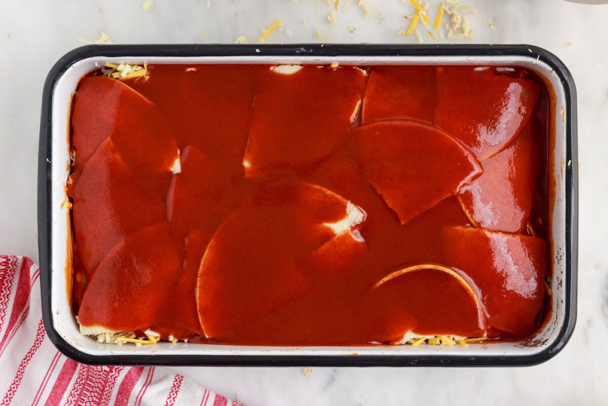enchilada sauce on top of totillas