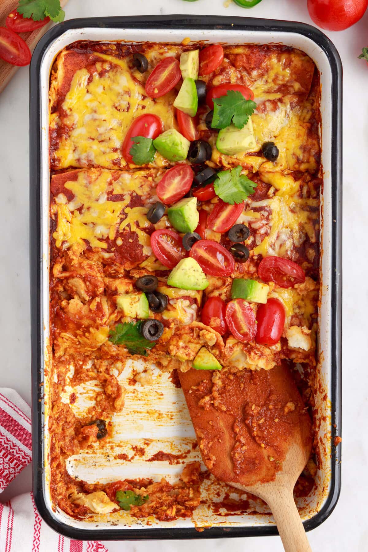 serving a piece of Chicken Enchilada Casserole
