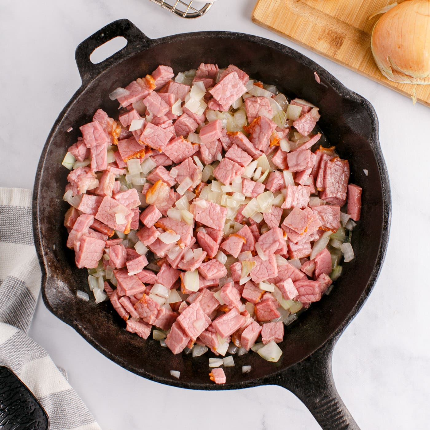 corned beef and onions in a skillet
