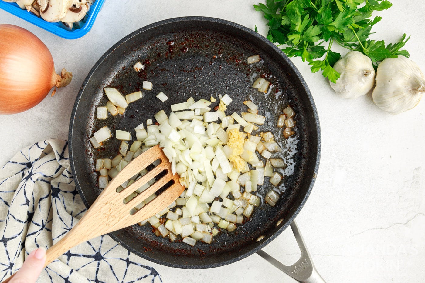 sauteeing onion and garlic in skillet