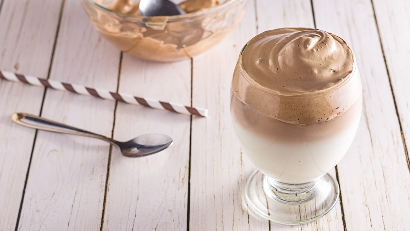 Dalgona coffee, also known as whipped coffee, features a dense mousse-like topping made with instant