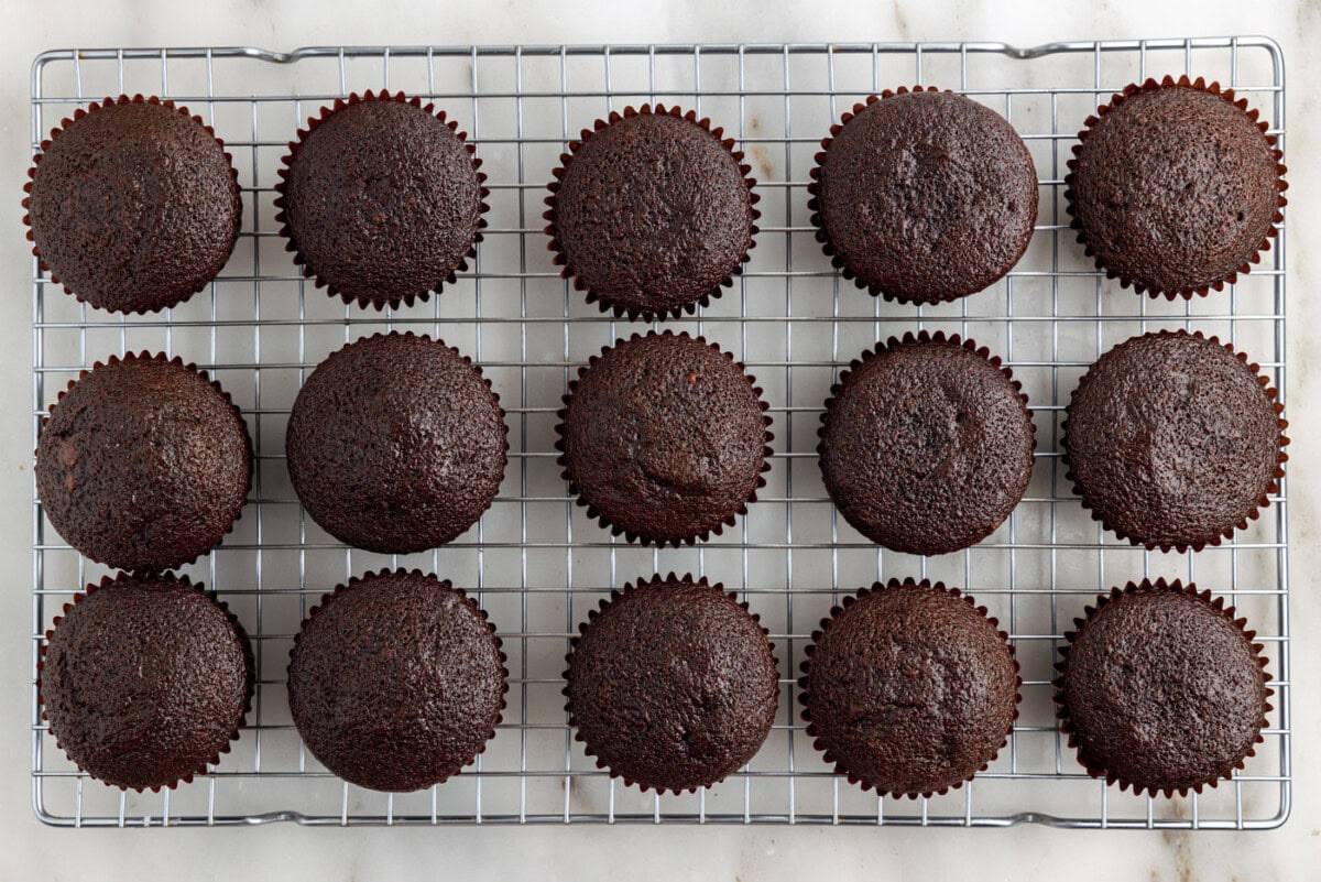 chocolate cupcakes on a wire cooling rack