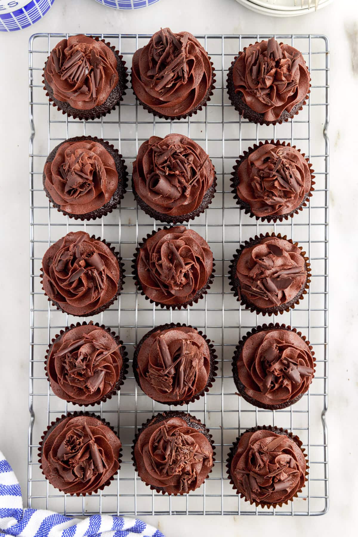 Frosted Double Chocolate Cupcakes on a wire cooling rack