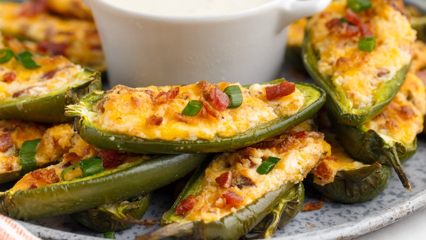 Jalapeno poppers are as simple as slicing up some plump jalapenos, stuffing them to the brim with a 
