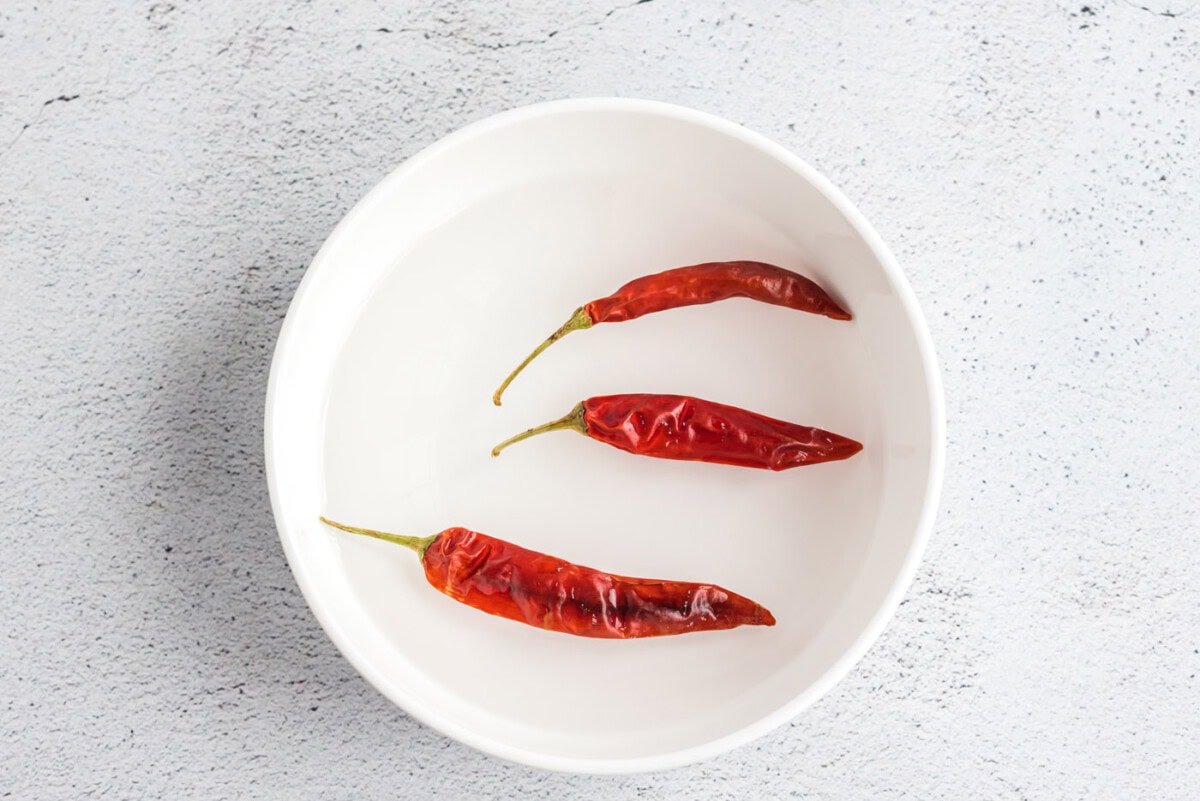 red chiles in a bowl of water