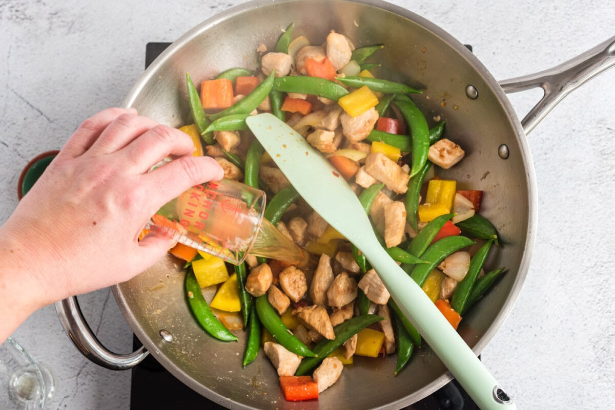 kung pao chicken stir fry in a wok