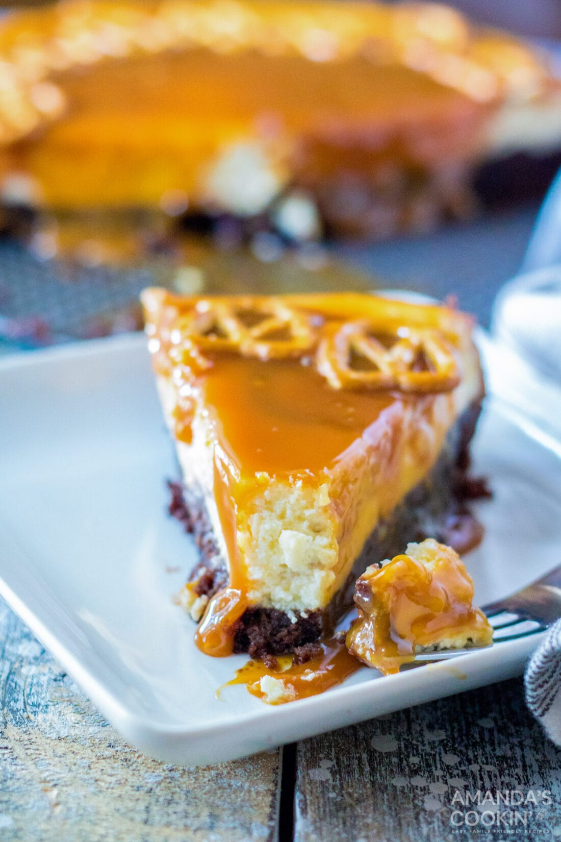 slice of Salted Caramel Cheesecake with bite out of it