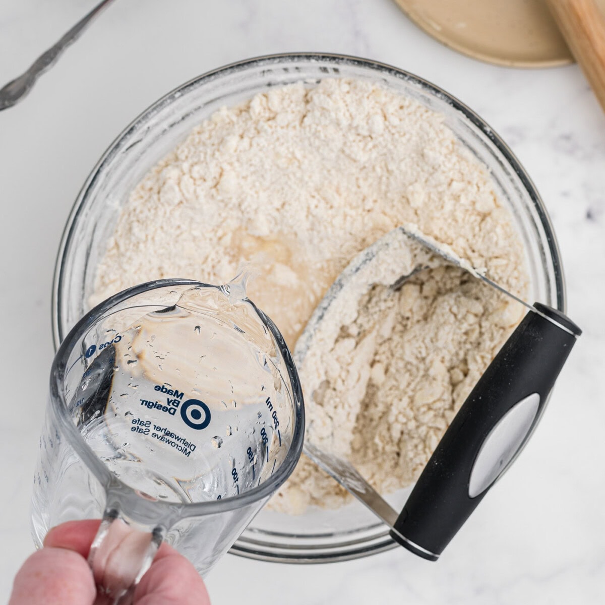 adding water to butter and flour mixture