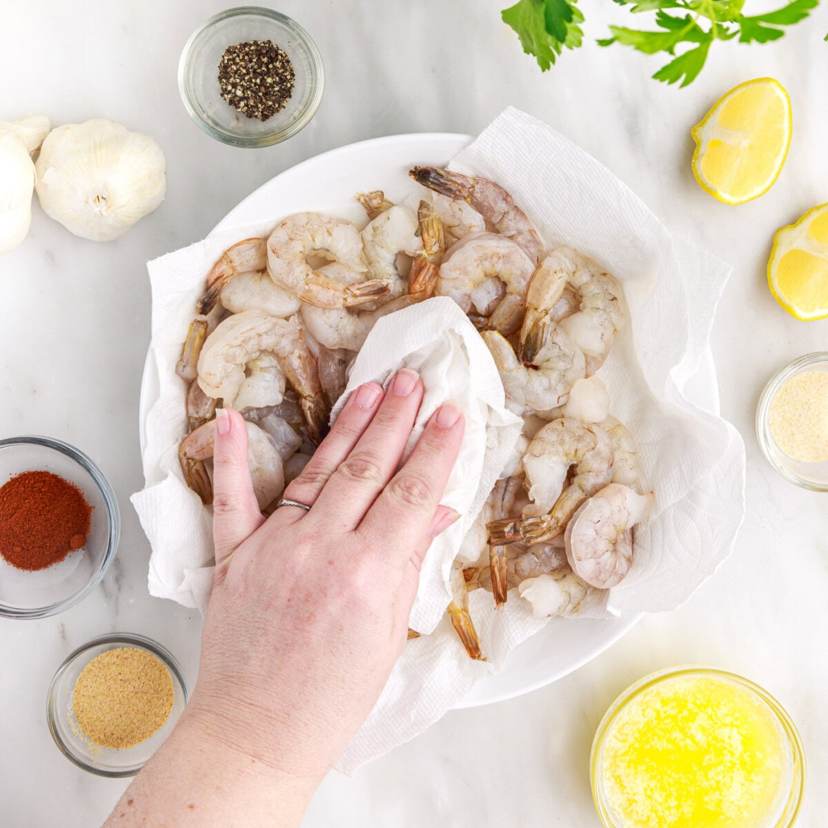 patting shrimp dry with paper towel