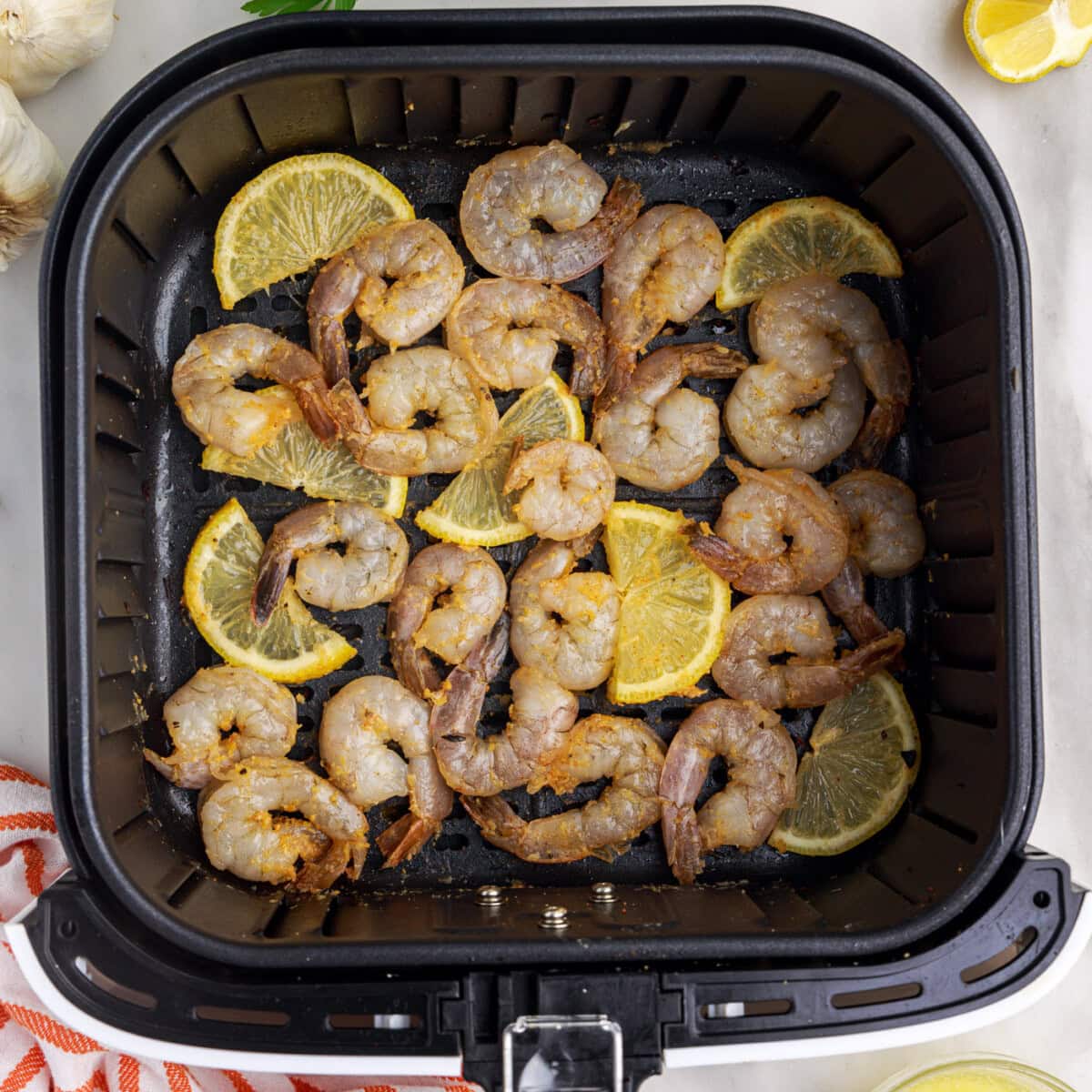 raw shrimp in the air fryer with lemon