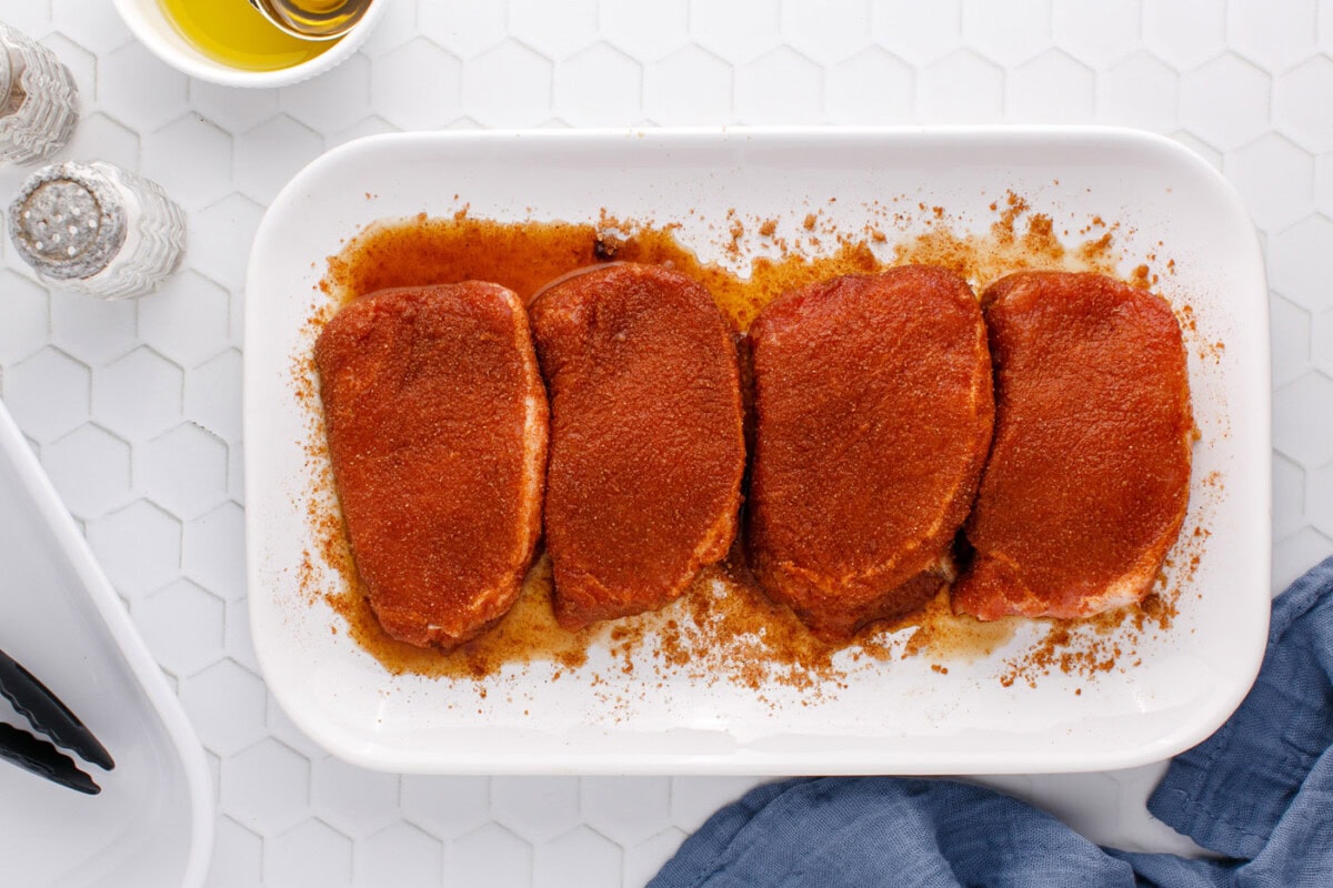 seasoned pork chops on a serving platter