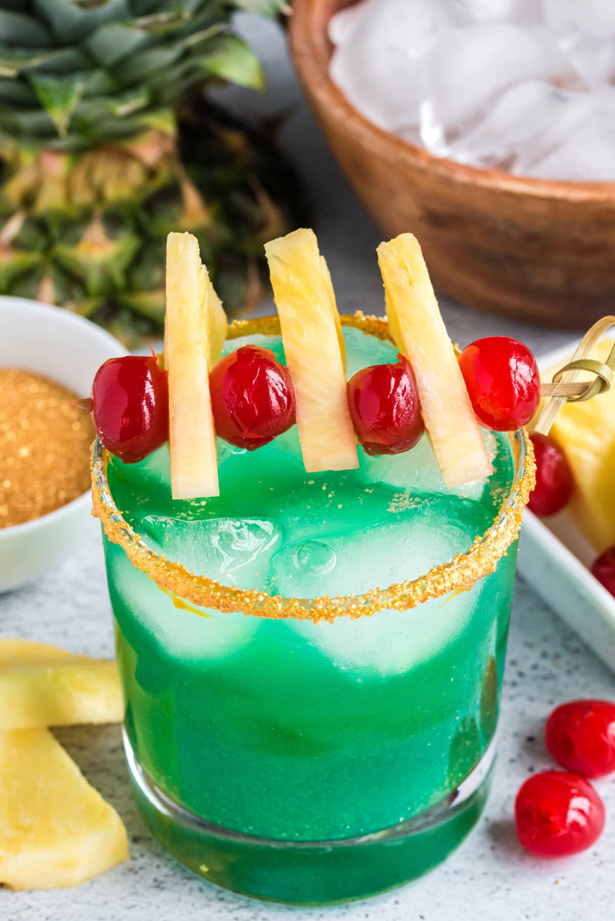 green cocktail in a sugar rimmed glass
