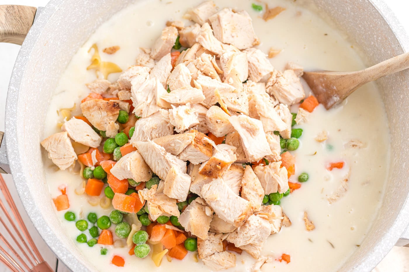 chicken, peas, and carrots in egg noodle mixture