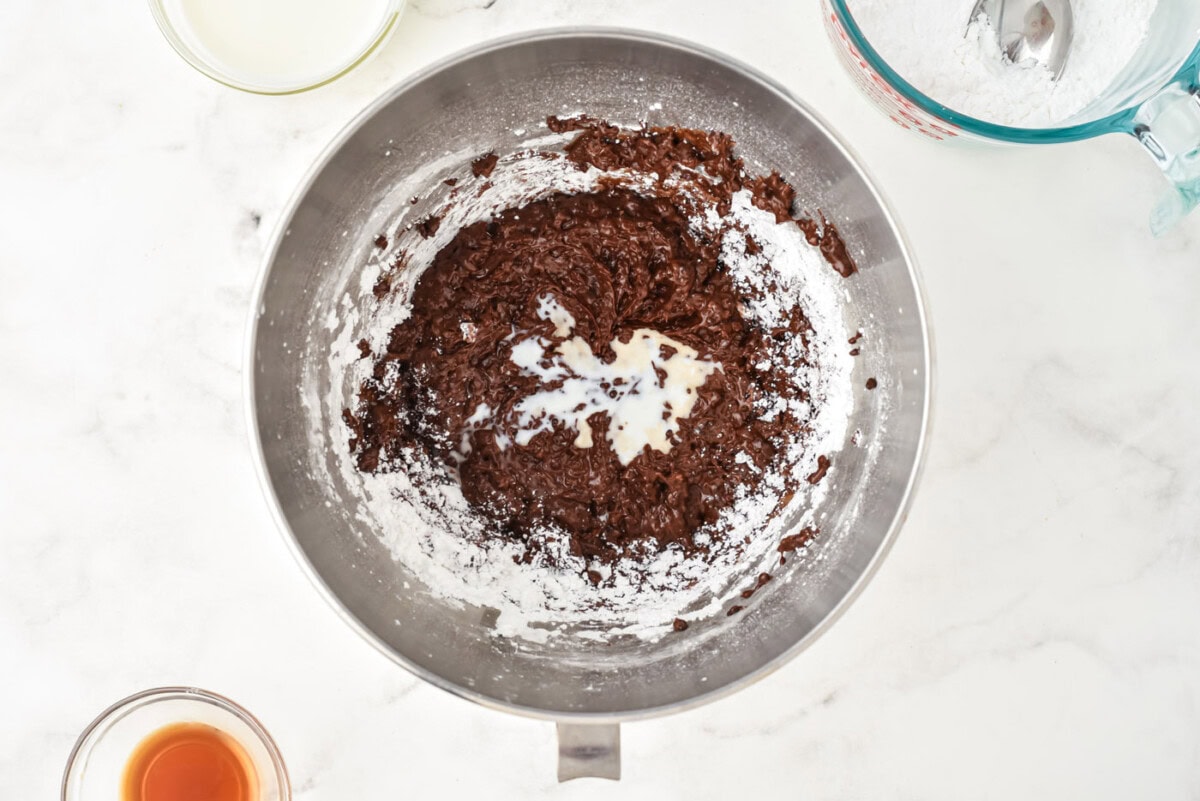 powdered sugar and heavy cream in chocolate mixture