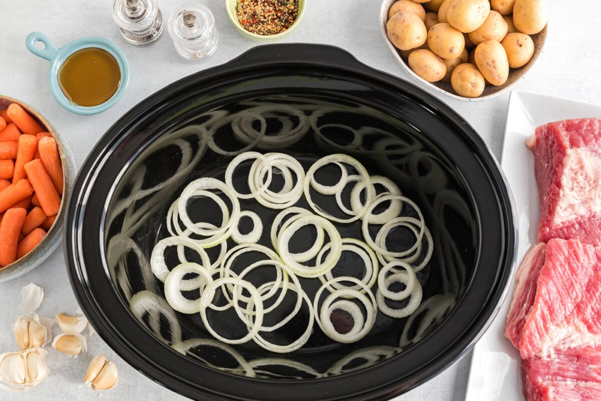 sliced onions in crockpot