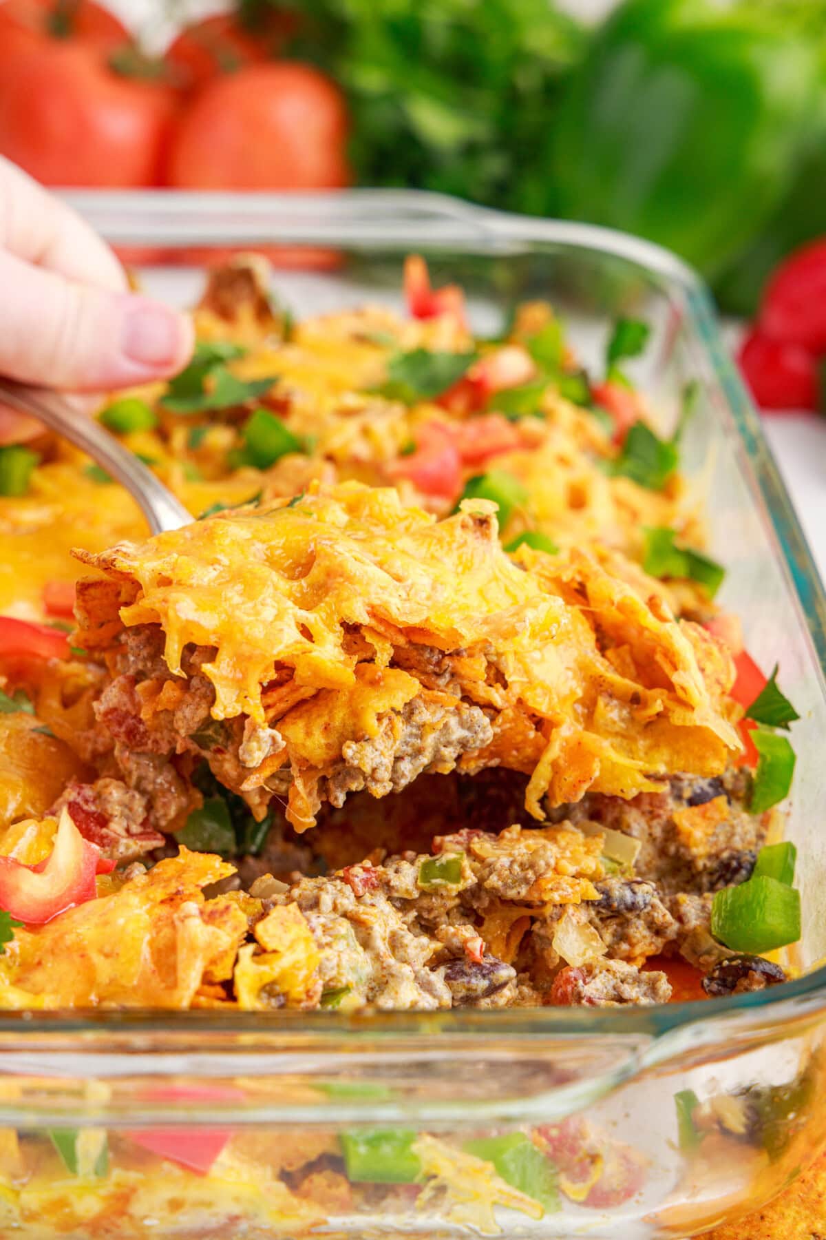 LIFTING OUT A SERVING OF Dorito Casserole