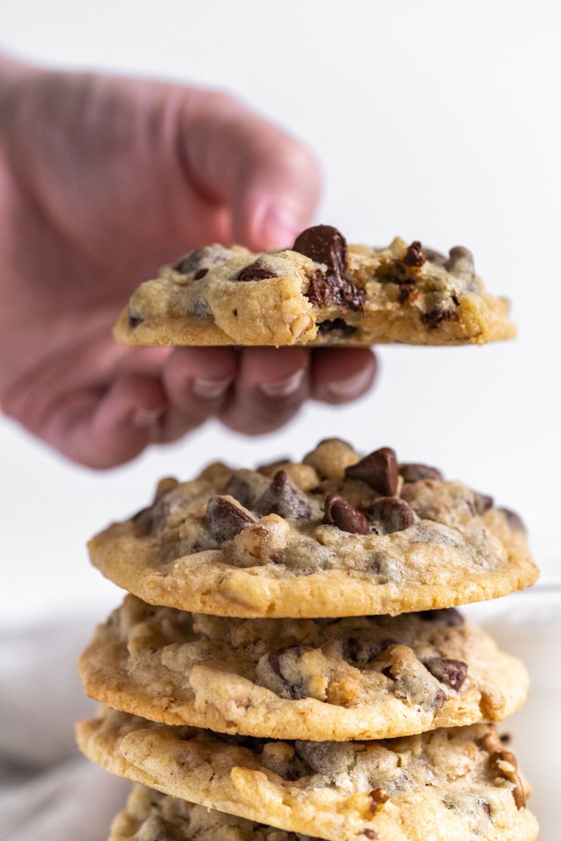 holding a Doubletree Chocolate Chip Cookie