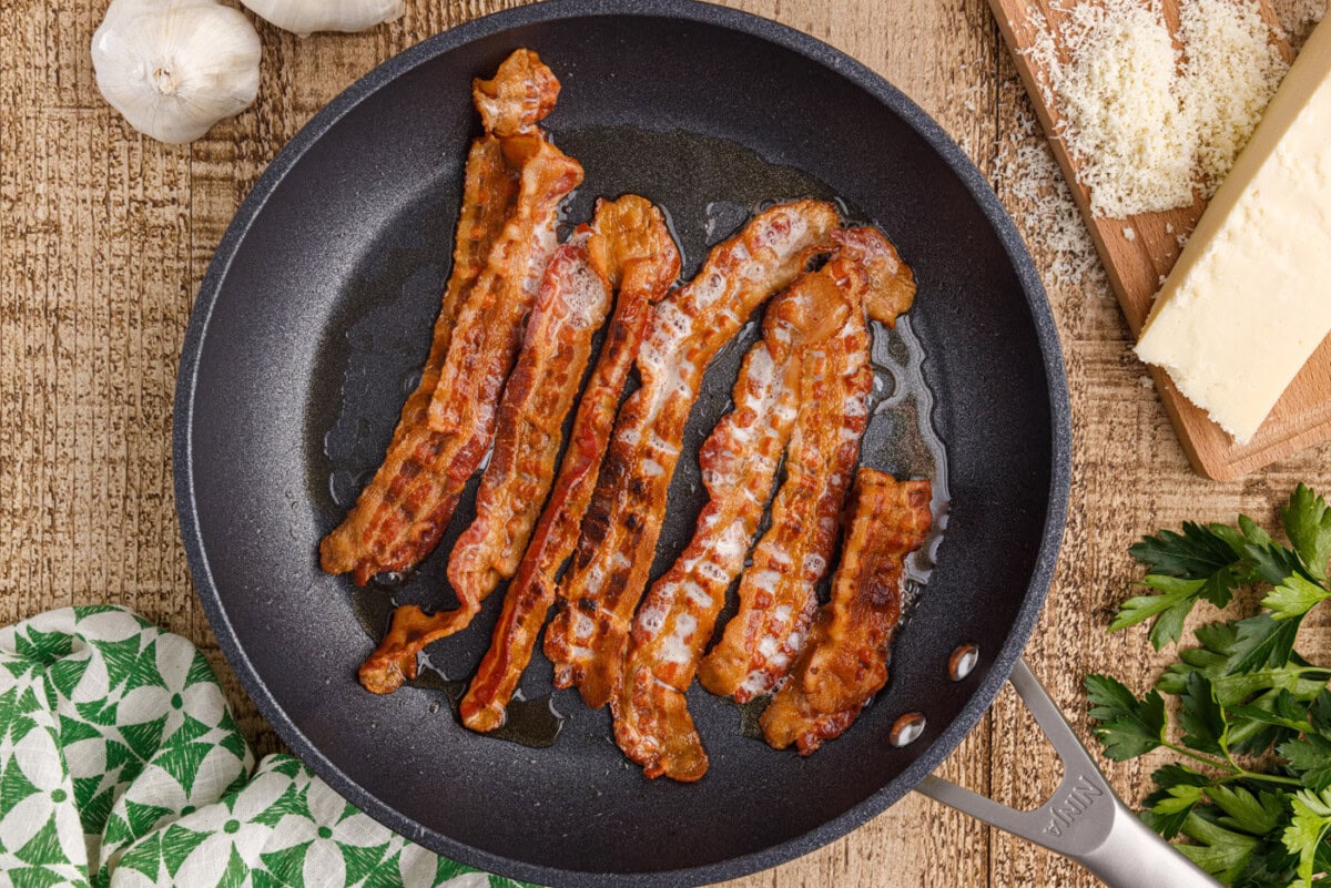 bacon cooking on a skillet