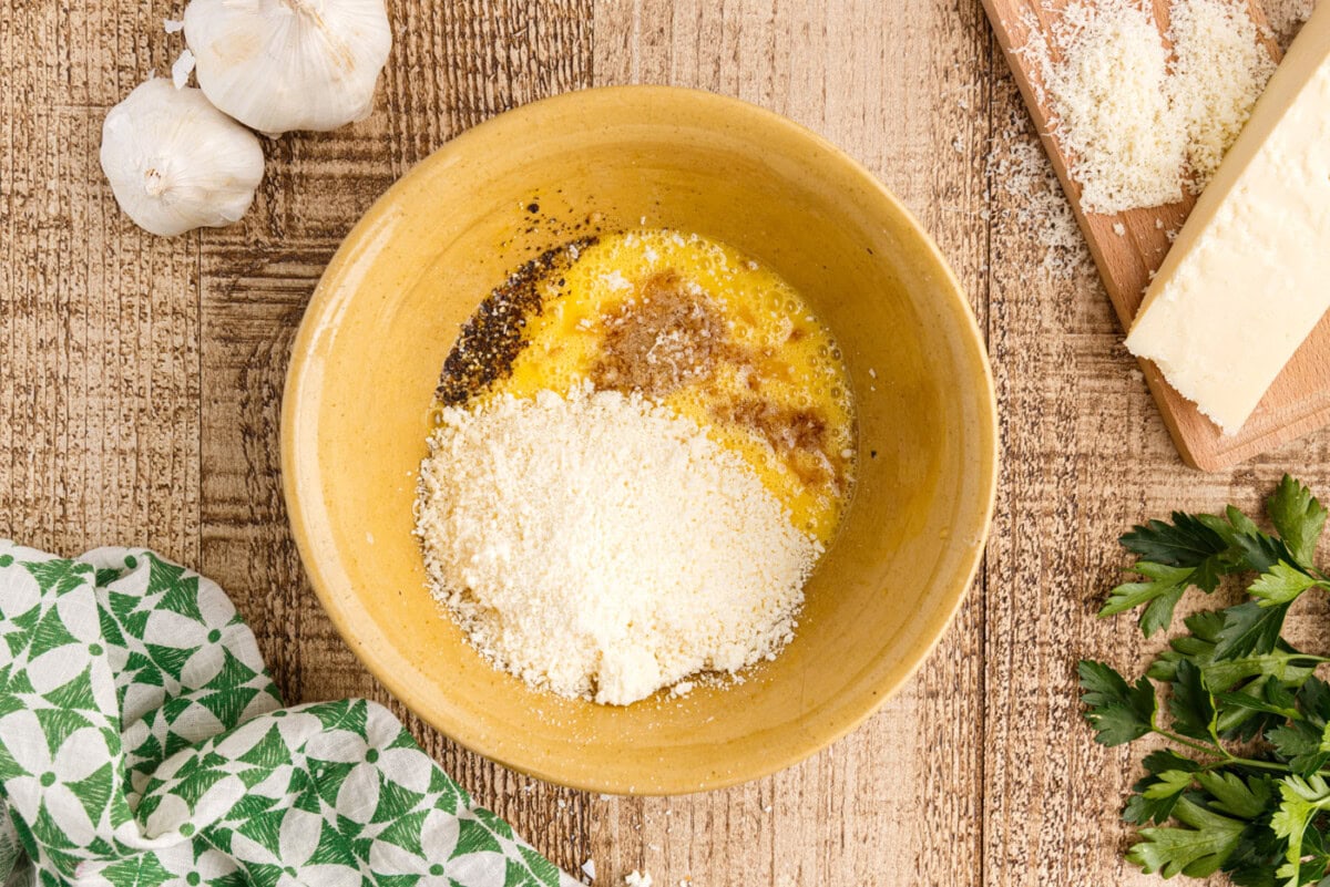 eggs, cheese, and seasonings in a bowl