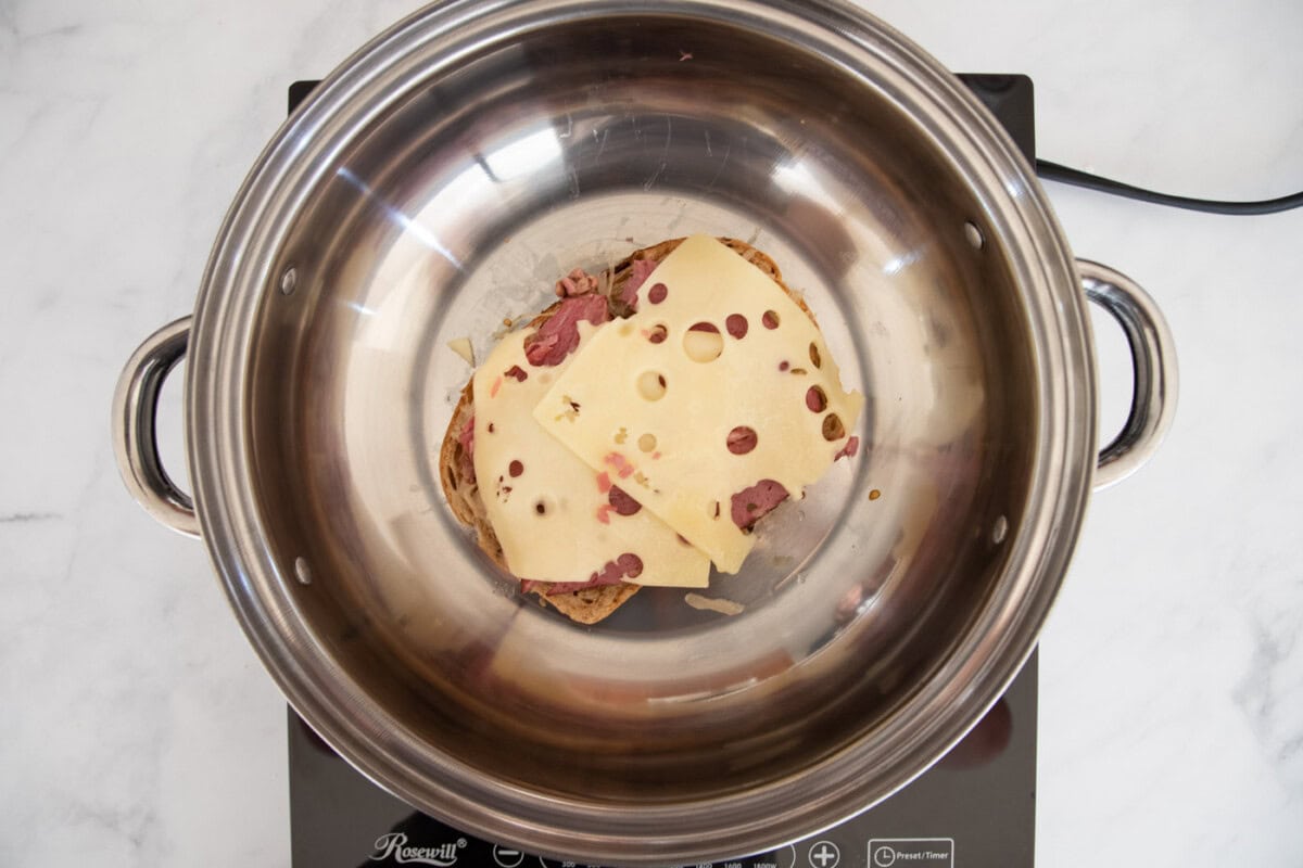 corned beef with cheese in a skillet