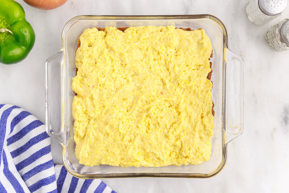 sloppy joe cornbread casserole in a baking dish