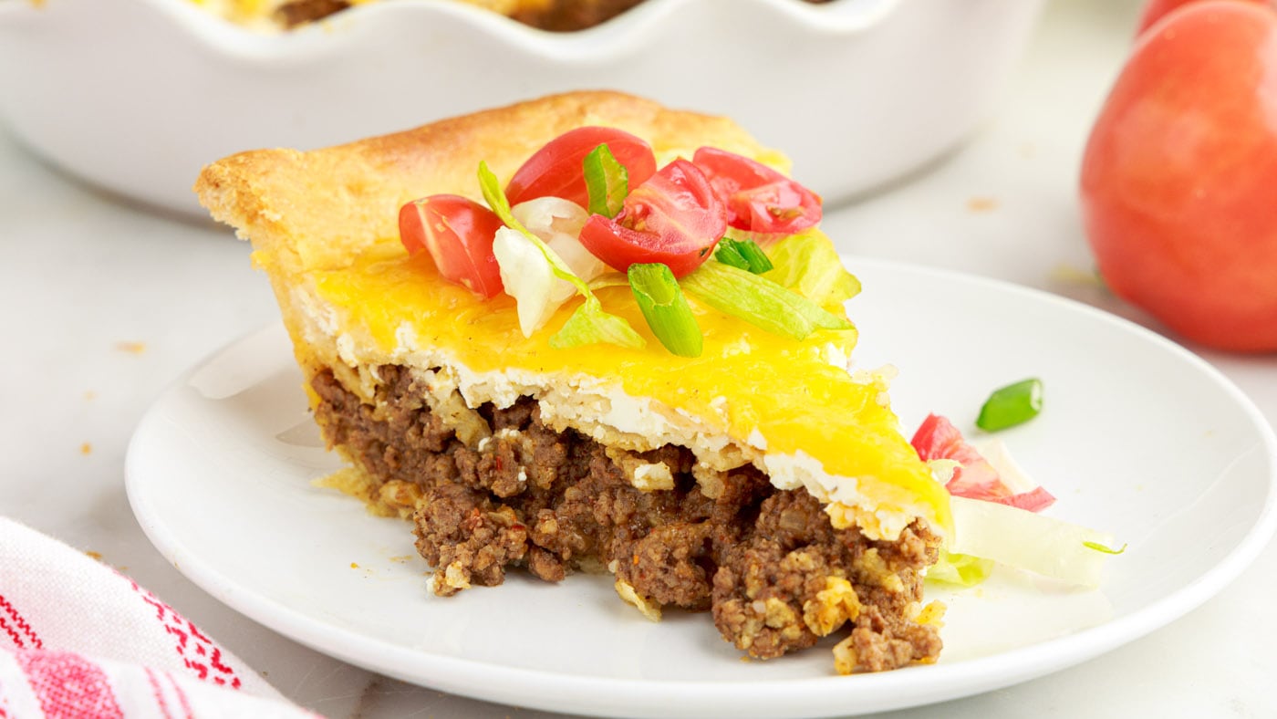 Another ground beef recipe to add to your arsenal, this taco pie recipe is layered like a taco but b