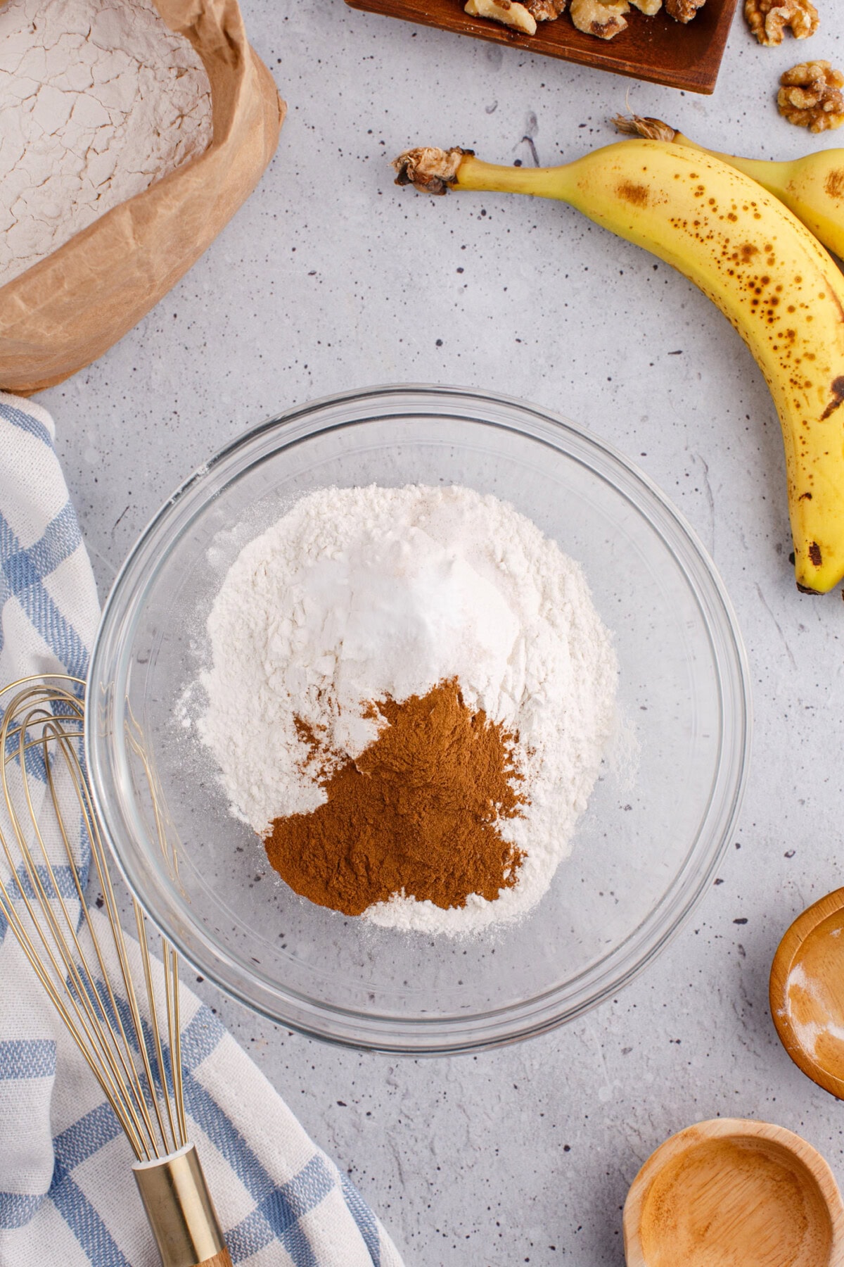 dry ingredients for banana nut bread in a mixing bowl