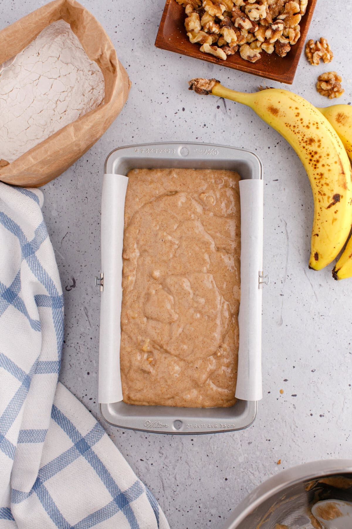 banana bread batter in a loaf pan
