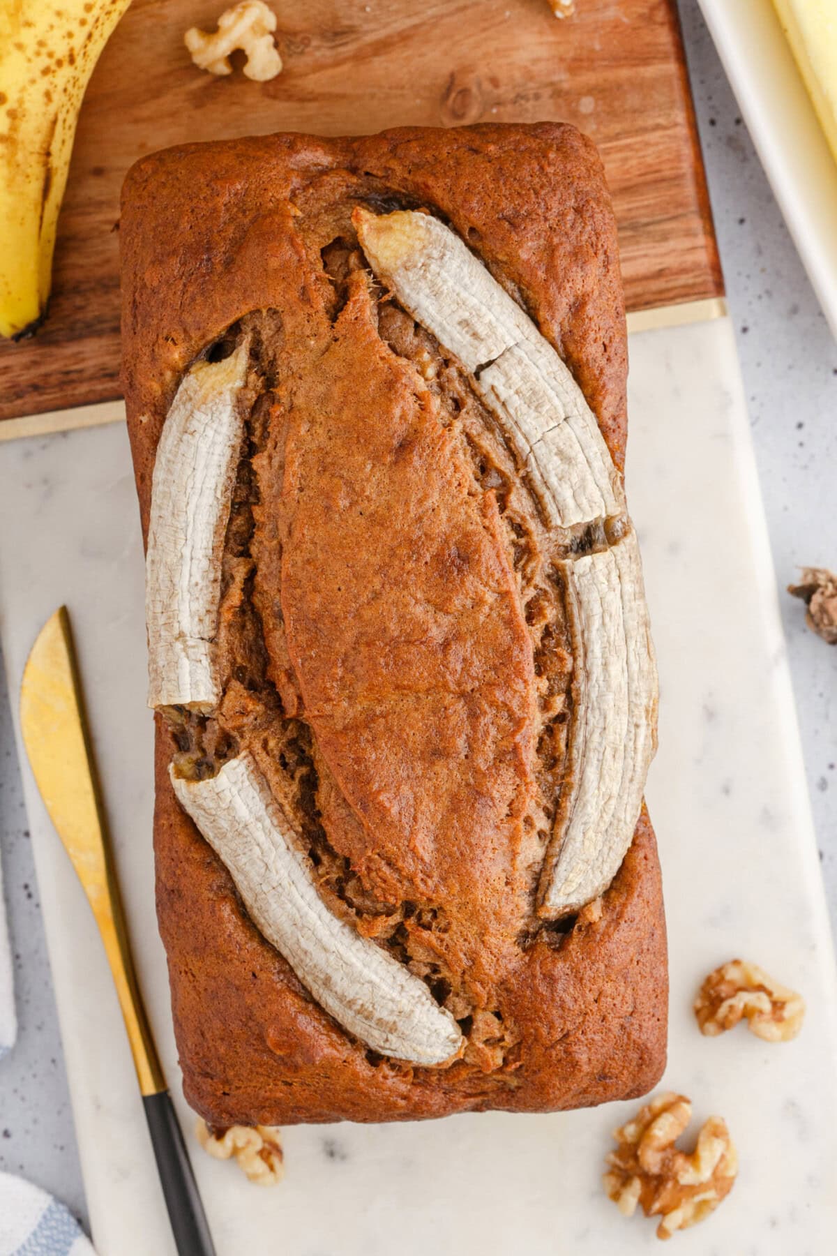 overhead view of Banana Nut Bread with banana garnish