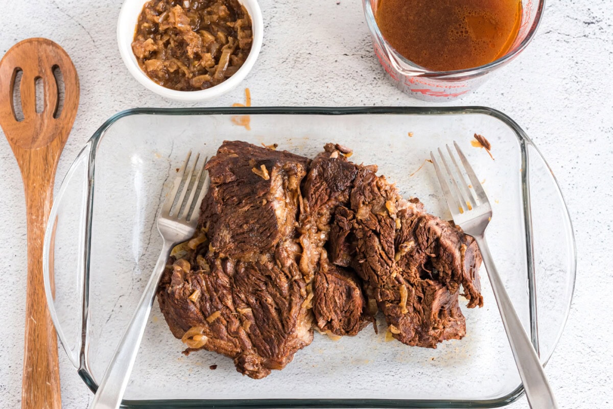 shredding beef with forks